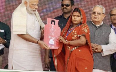 PM Narendra Modi handing over Ujjawala connection to a beneficiary