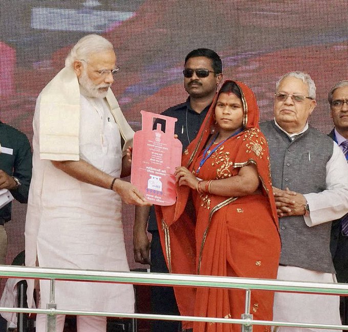 PM Narendra Modi handing over Ujjawala connection to a beneficiary