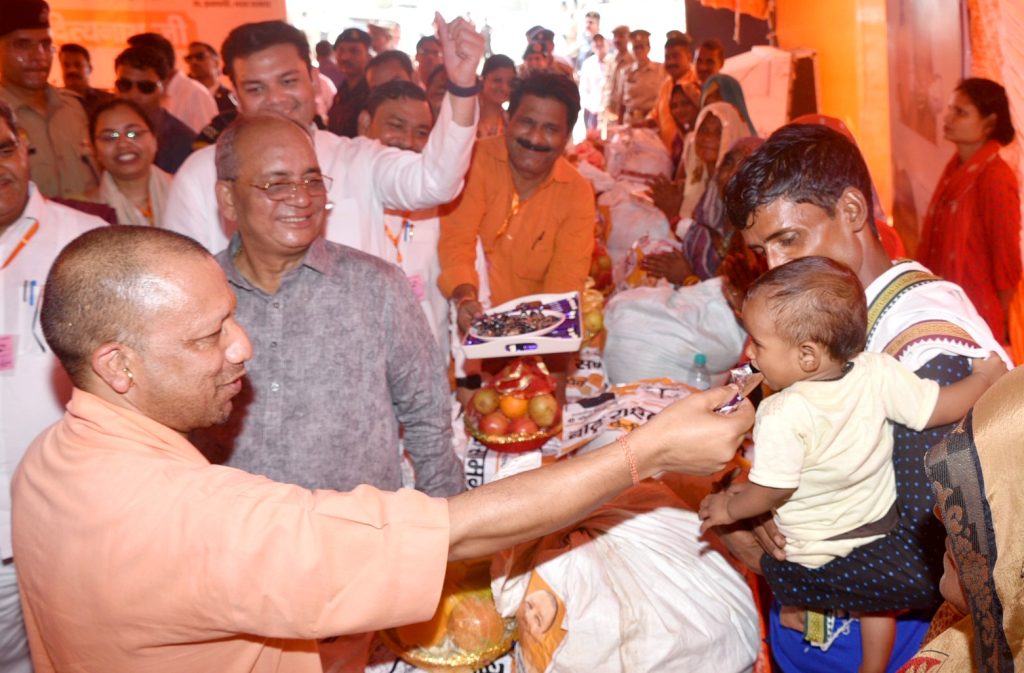 Uttar Pradesh CM Yogi Adityanath distributes relief to flood affected people.