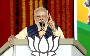 PM narendra Modi in a NIzamabad rally on Tuesday