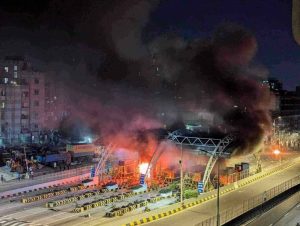 Protestors set fire a toll plaza in Bangladesh