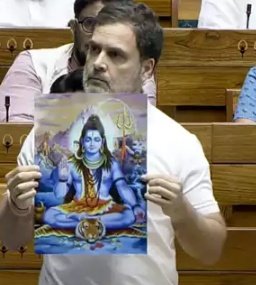 Leader of Opposition in the Lok Sabha Rahul Gandhi shows portrait of Lord Shiva