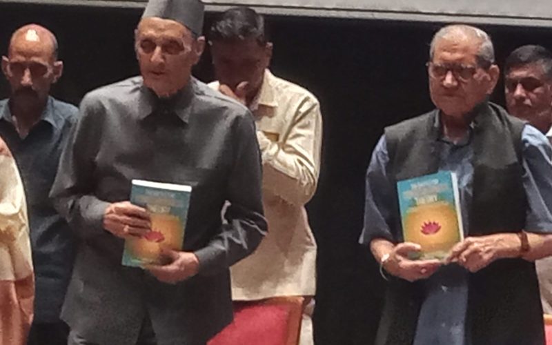 Dr Karan Singh with Prof. Kapil Kapoor unveiling the book The Battle for Consciousness