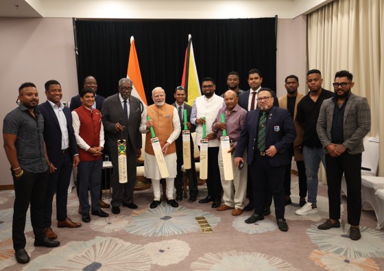 PM Narendra Modi with cricketers in Georgetown Image credit X.com @PMOIndia