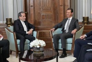 Syrian President Bassar al-Assad with Iranian deputy foreign minister Image credit X.com @MarkUrban01