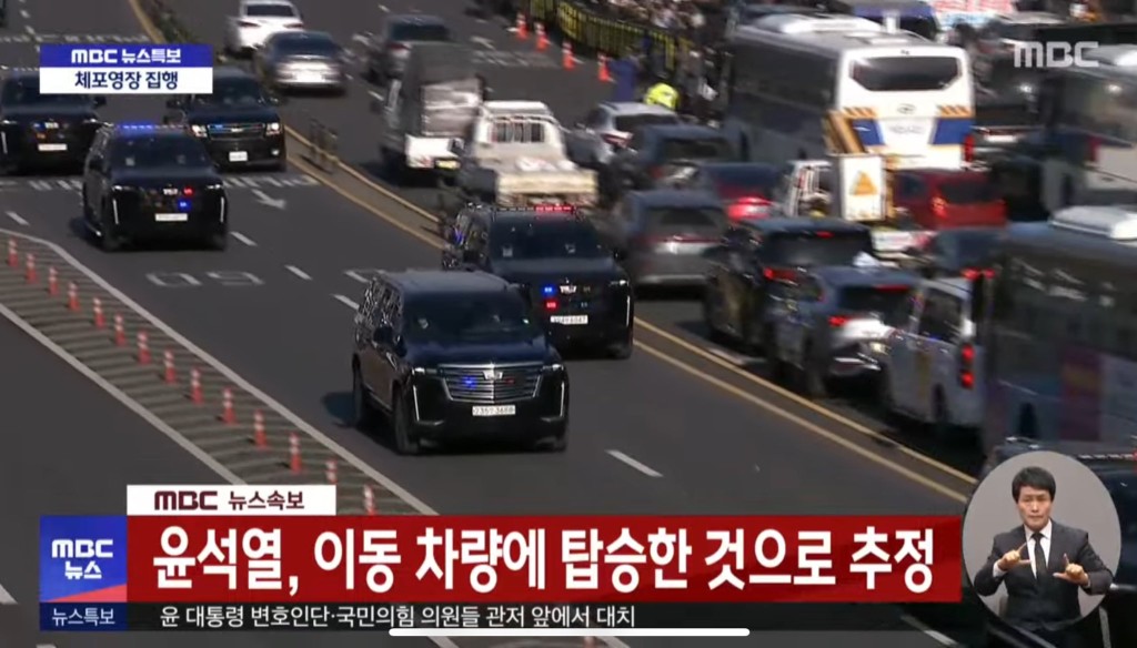 Video grab of police cavalcade taking impeached South Korean President Yoon Suk Yeol