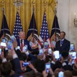 US President Donald Trump speaks to media in Washington.