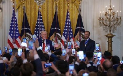 US President Donald Trump speaks to media in Washington.