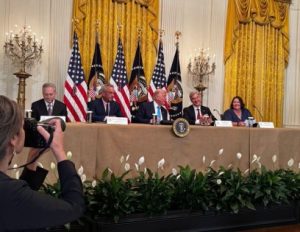 US President Donald Trump with health officials on Thursday.