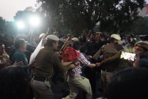 Delhi Police detain protestors at India Gate on Sunday.