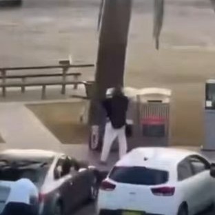 A bystander disarms a Bondi Beach attacker on Sundar.