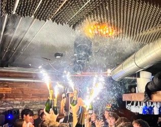 The fire started from sparkler candles which were placed on top of champagne bottles, officials confirm.