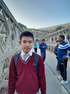 Myanmarese students cross bridge to come to Indian schools in Mizoram.