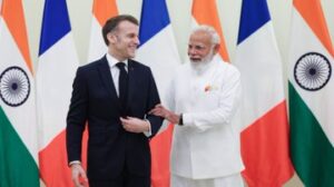 Prime Minister Narendra Modi with France President Emmanuel Macron in Mumbai on Tuesday.