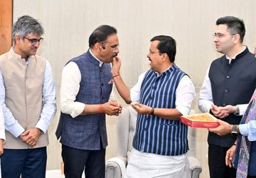 BJP president with defecting AAP leaders in New Delhi on Friday.