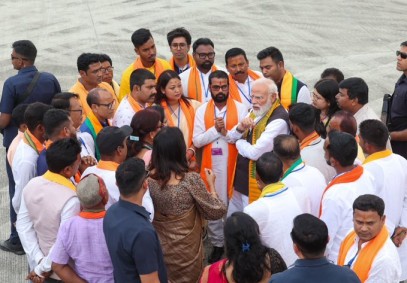 Prime Minister Narendra Modi interacts with BJP workers on a boat on Monday.