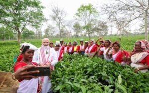 Prime Minister Narendra Modi with tea garden workers in Assam.