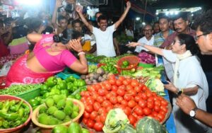 West Bengal CM Mamata Banerjee at a vegetable shop in Kolkata on Sunday evening..