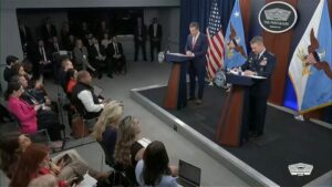 Defense Secretary Pete Hegseth and Joint Chiefs Chairman Gen. Dan Caine at a press briefing on Tuesday.