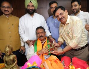 Delhi BJP leader Harsh Malhotra receiving congratulations from party members and supporters after being appointed the new Delhi BJP chief.