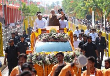 Prime Minister Narendra Modi during a roadshow in Guwahati on Tuesday.