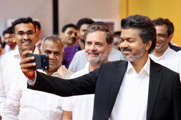 Tamil Nadu Chief Minister Vijay takes a selfie with Congress leader Rahul Gandhi.