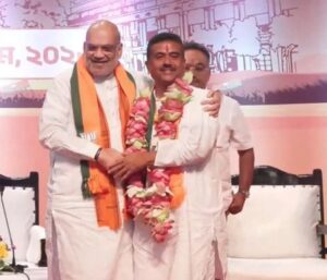 Union Home Minister Amit Shah Congratulates Suvendu Adhikari after his election as BJP legislative party leader in Kolkata.