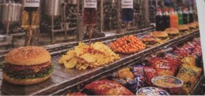 Packaged ultra-processed foods including chips, sugary drinks and instant snacks displayed alongside fresh fruits and vegetables symbolising dietary transition.