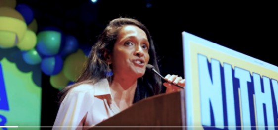 Los Angeles City Councilmember Nithya Raman speaks at a campaign rally, addressing a large audience gathered to hear her remarks on local issues and community engagement.