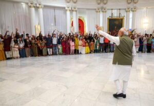 Prime Minister Narendra Modi waves at Indian diaspora in Paris on Sunday.