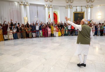Prime Minister Narendra Modi waves at Indian diaspora in Paris on Sunday.