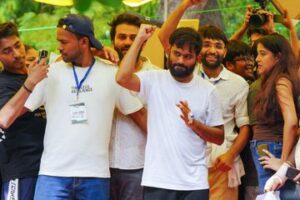 Cockroach Janata Party leaders celebrate resignation of Union Minister for Education Dharmendra Pradhan.