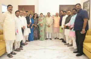 Former Union Minister for Education Dharmendra Pradhan with BJP MPs in parliament.