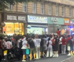 Riot police in formation on Edgware Road, London, after Morocco’s World Cup exit.