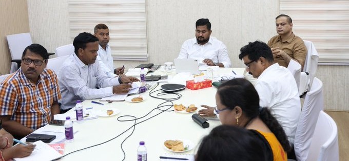 Odisha education department officials hold a review meeting.