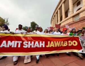 Congress leader Rahul Gandhi leads a march in praliament to demand Home Minister Amit Shah's presence in the House.