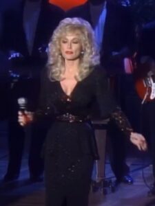 Dolly Parton performing on stage during her decades-long music career.