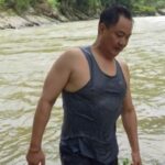 Union Minister Kiren Rijiju swims in an Arunachal river.