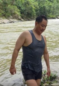 Union Minister Kiren Rijiju swims in an Arunachal river.