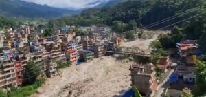 Massive flash flood strikes Nepal, leaving hundreds missing and buildings swept away.