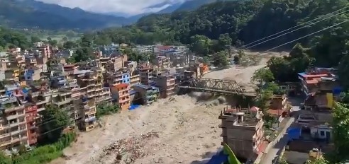 Massive flash flood strikes Nepal, leaving hundreds missing and buildings swept away.