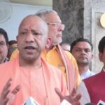 Uttar Pradesh CM Yogi Adityanath speaks to reporters in Lucknow on Tuesday.