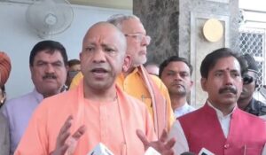 Uttar Pradesh CM Yogi Adityanath speaks to reporters in Lucknow on Tuesday.