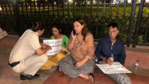 Activist Yogita Bhayana with parents of Ankita Bhandari at India Gate.