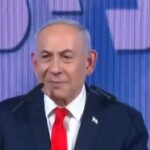 Benjamin Netanyahu addresses supporters at a convention centre in Jerusalem on election night.