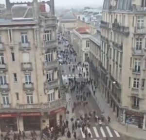 French riot police facing high school student protesters outside a blockaded lycée.