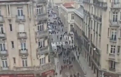 French riot police facing high school student protesters outside a blockaded lycée.