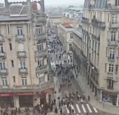 French riot police facing high school student protesters outside a blockaded lycée.