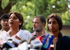 NSUI leader Ritu Barala recounts her alleged assault during police detention while standing alongside Rahul Gandhi.