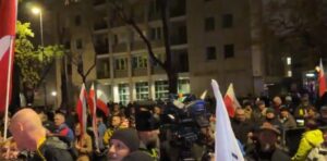 Riot police stand guard outside Poland’s Constitutional Tribunal in Warsaw as protesters gather at the gates.